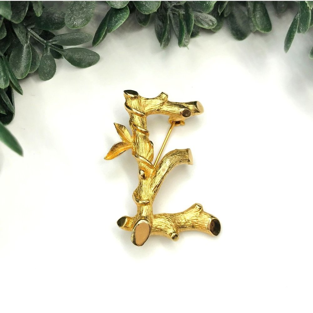 Brooch letter E gold tone branch with leaves by Sarah Cov